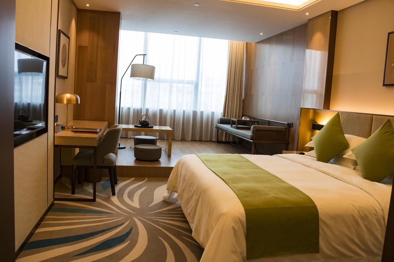 Leshan Ramada Hotel Bagian luar foto